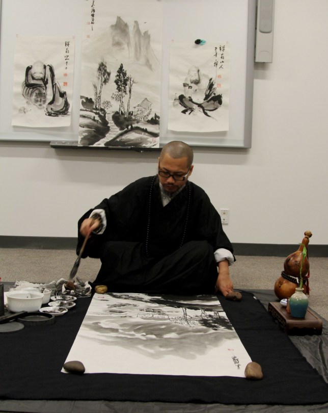 Yixiong GU artists to demo Zen brush painting.